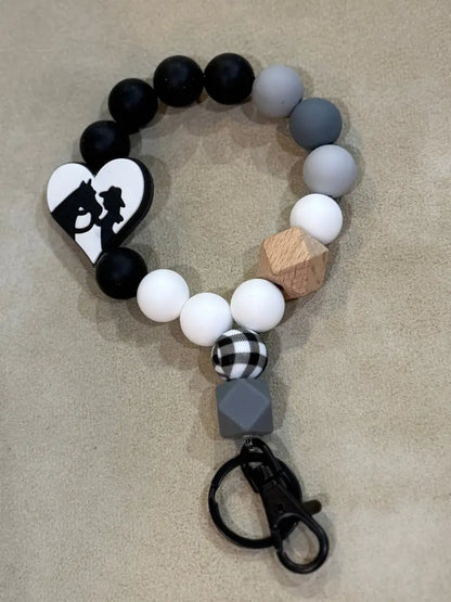 Silicone Bead Wristlet Keychain 15. Black/Gray/White/ Silhouette Human Accessories